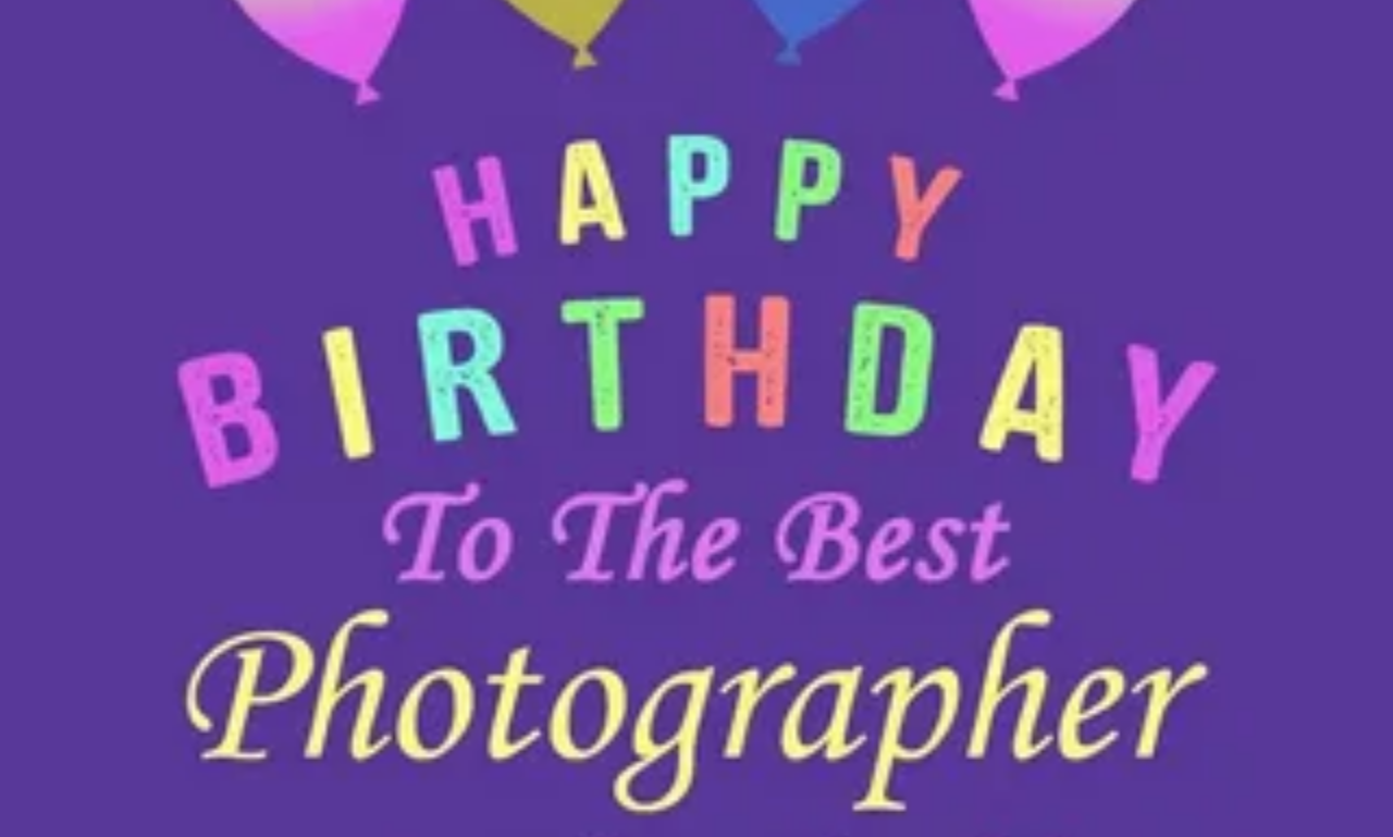 Happy birthday for a photographer with a camera, birthday cake, and creative celebration